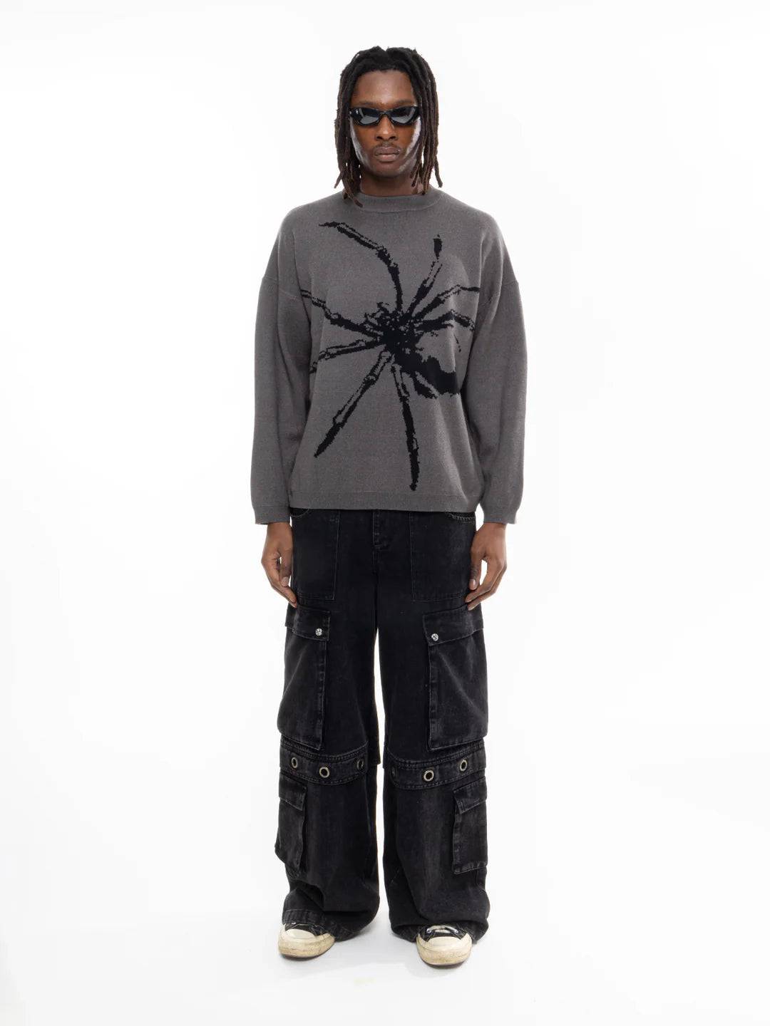 Shop the Arachnid Sweater – a spider graphic gray sweater perfect for streetwear lovers. Made from lightweight polyester with a relaxed fit for ultimate comfort, it’s easy to care for and designed to last. Unisex sizes M to 2XL make it the ideal casual statement piece. Get yours today!